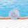 a woman in the pool with a hat