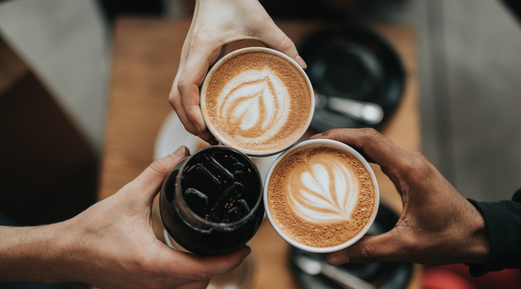 Vibrant local community with plenty of dining options a group of people holding their coffee cups